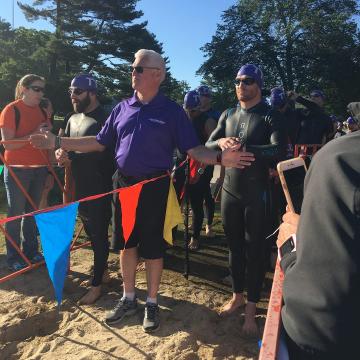 Jeff lined up for the swim start in his Roka wetsuit and purple swim cap. PC: Lianne Dusek